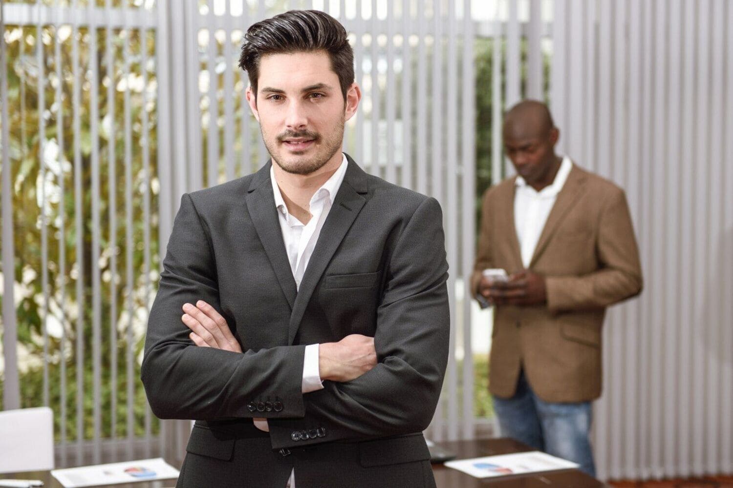 Young business man working using computer withserious expression on face simple.